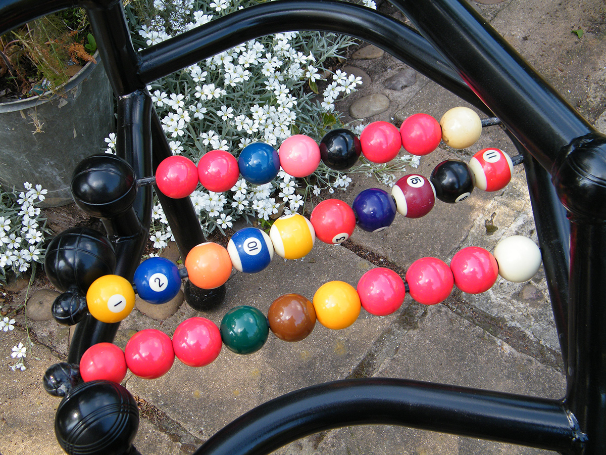 Champions Chair - created from welded steel tubes and rod, snooker and pool balls, steel petanque balls 