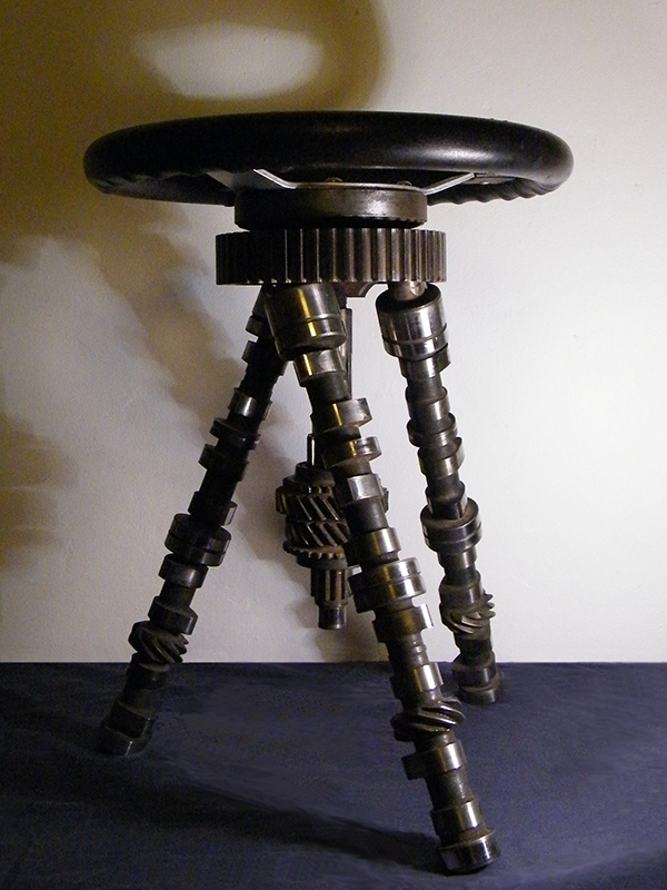 Modern welded metal furniture - created from car parts including mini camshafts and steering wheel