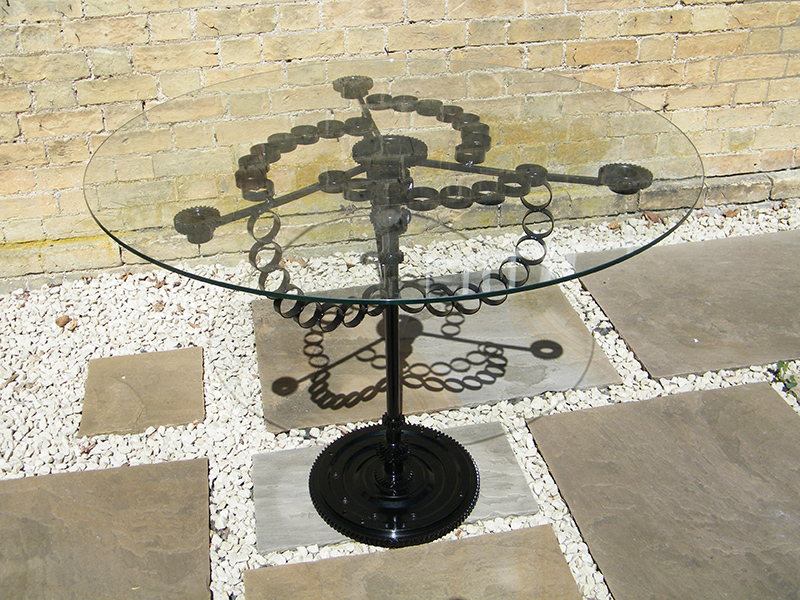 Glass table created from recycled steel and glass