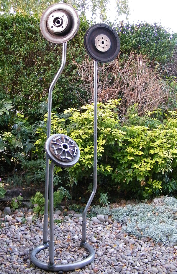 Welded metal sculpture - created from found objects, car parts and metal tubing